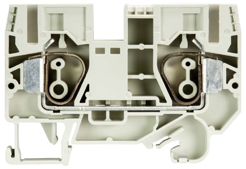 A beige electrical terminal block reveals a complex internal structure with metal connectors and multiple chambers.