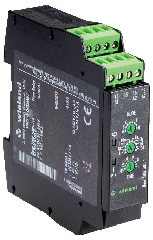 A black electric time relay with green terminals and labels, suitable for use in control systems.