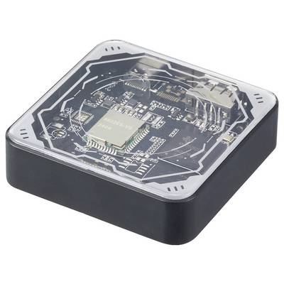A black plastic container with a transparent lid displays electronic components, including a microchip, on a circuit board.