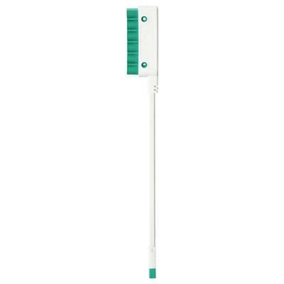A white toothbrush with a green head and bristles, standing upright.