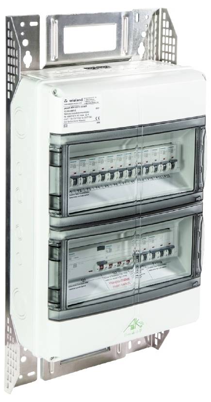 Electrical distribution board with two transparent doors, multiple switches and fuses inside, mounted on a metal bracket.