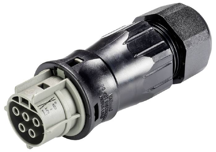 'Black electrical connector with multiple round socket slots and labelling. Cable closure visible on the right.'