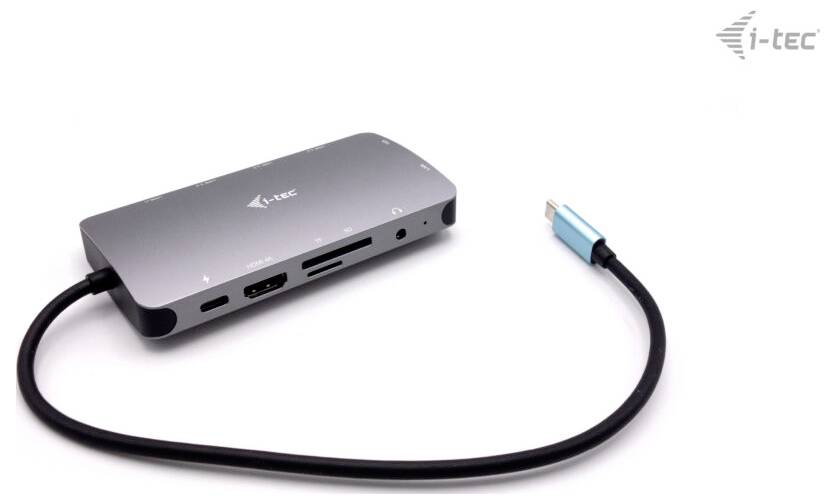 A grey i-tec USB-C hub with multiple ports, including HDMI, USB and a card reader. A blue USB-C cable is connected.
