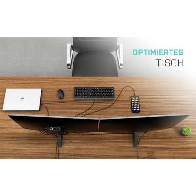 Optimised desk with two monitors, laptop, keyboard, mouse, and smartphone. Swivel chair and potted plant in the background.