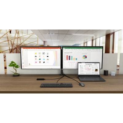 A desk with two large monitors displays a presentation and an Excel spreadsheet. A laptop shows news. Office background.