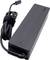 A rectangular, black laptop power adapter with a USB-C port and a long cable.