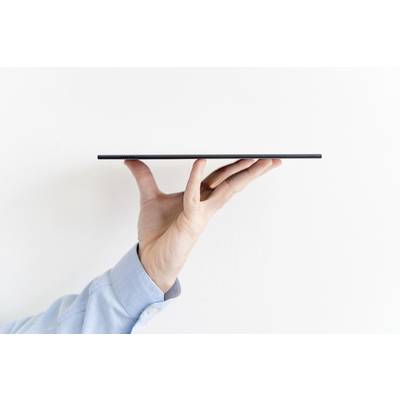 A tablet is being balanced on one hand, showing its slim profile. The background is white.