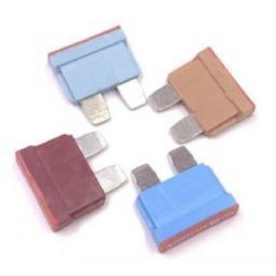 Four coloured automotive fuses in blue, brown, and red are arranged in a circular formation. Each fuse has two metal contacts.