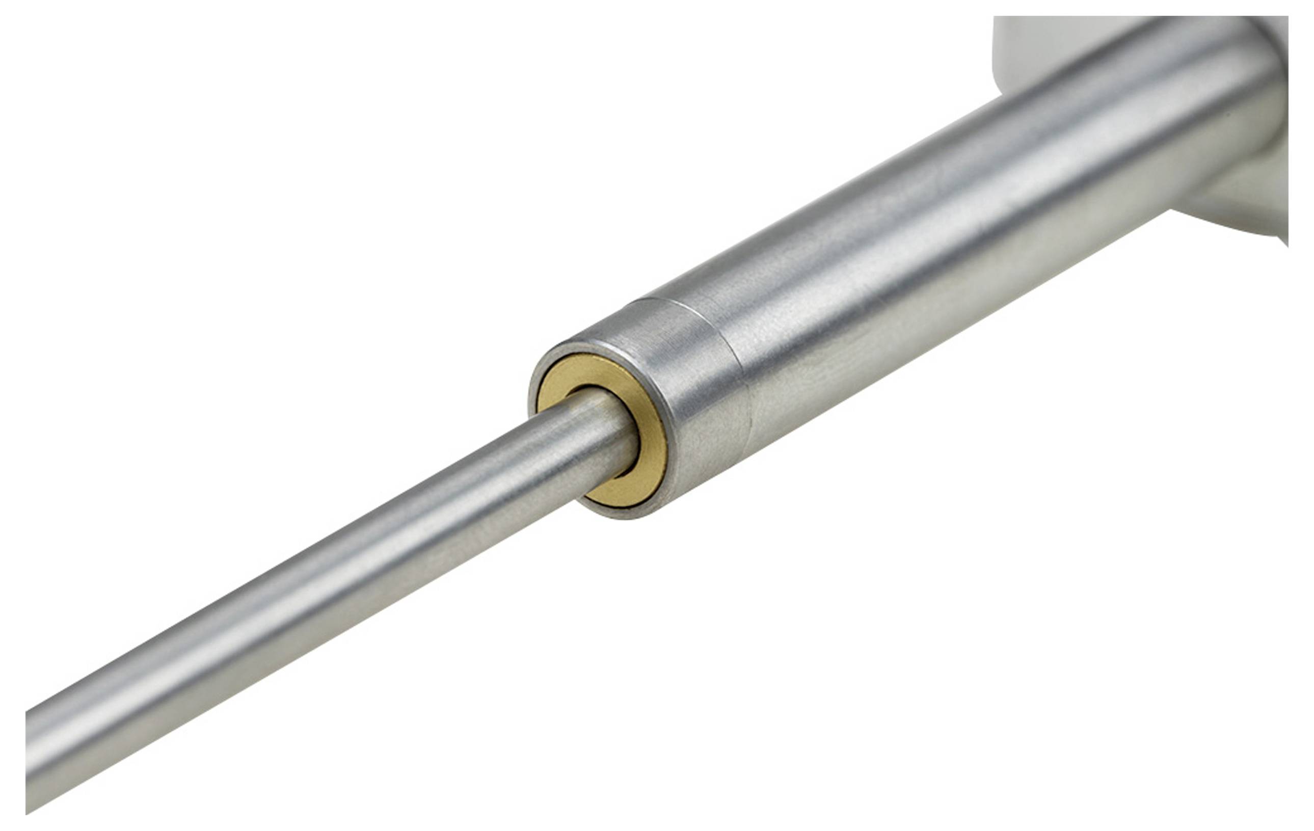 Close-up of a mechanical component with a metallic cylinder and a thin rod protruding from the centre, possibly a piston.