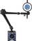Magnetic dial indicator with pivoting arm, scale and adjustment knob. Instrument for precise measurement of mechanical parts.