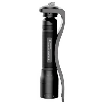 Black device with a cylindrical body and a curved handle on the side, possibly a torch or similar tool.