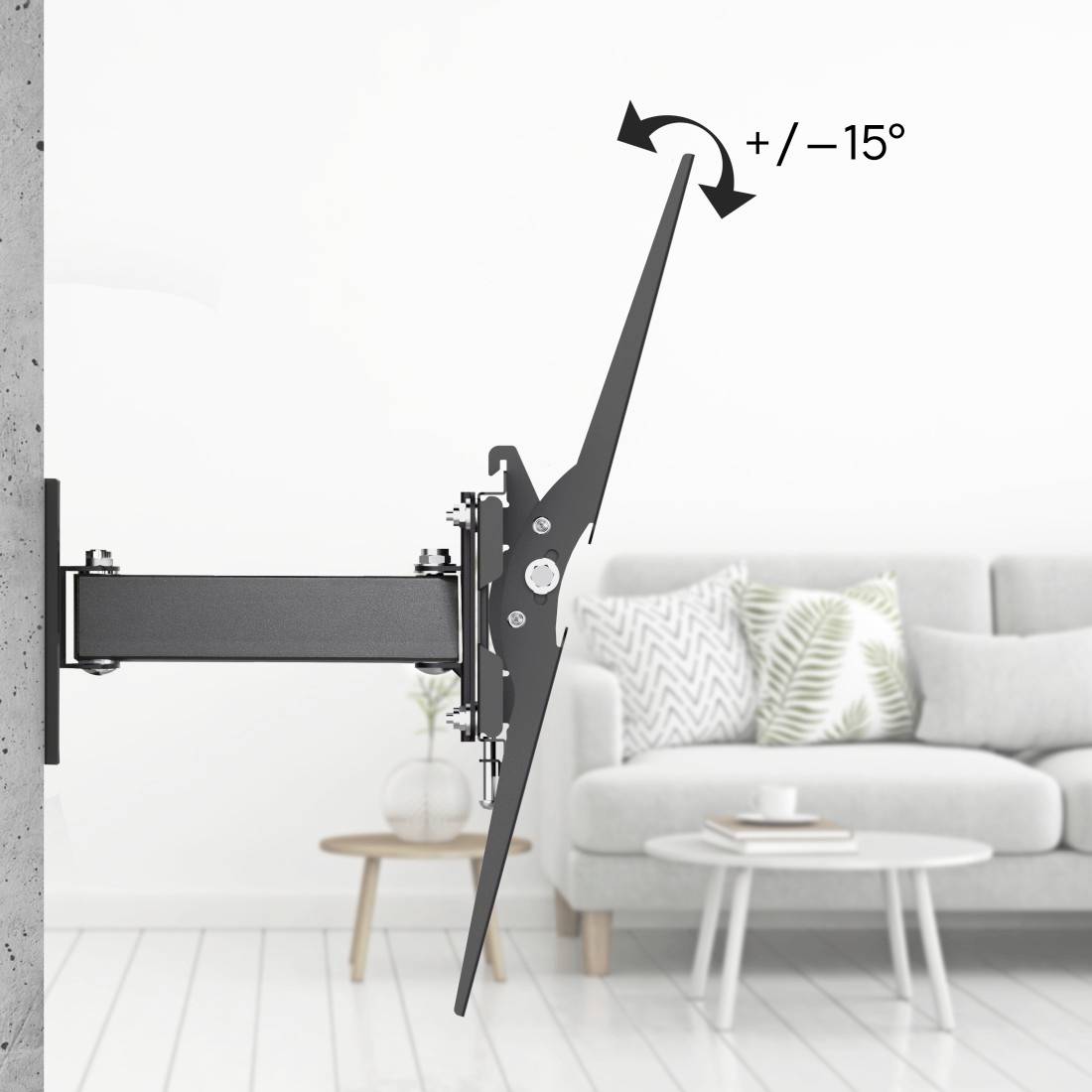 Wall-mounted television bracket. Shows tilting options of +/- 15 degrees. Background: Living room with sofa and table.