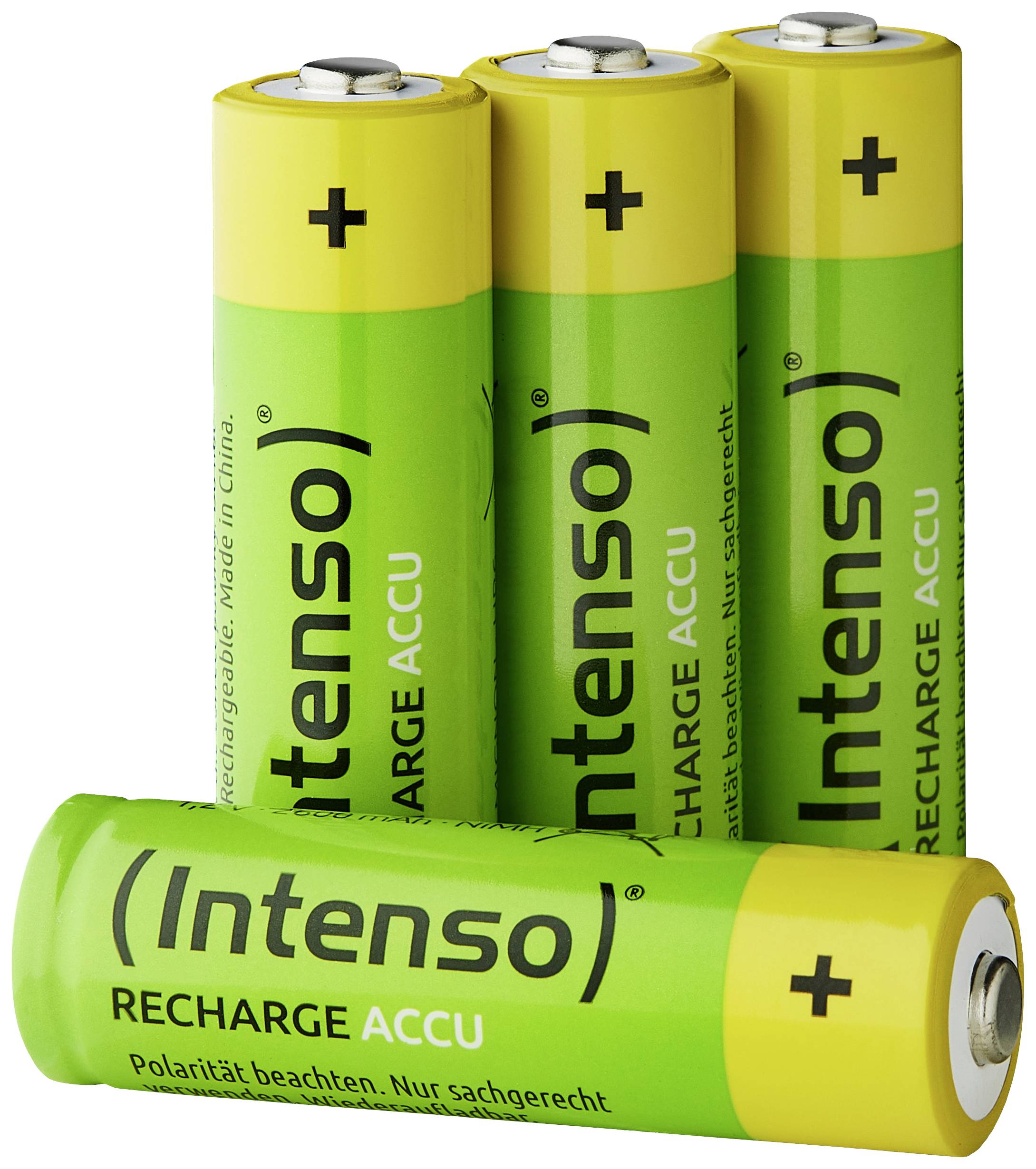 Four green AA batteries by the brand 'Intenso', all with yellow ends and an upright plus symbol. One battery is lying in the front, the others are standing.