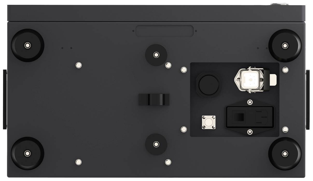 The underside of a technical device with wheels and multiple connectors.