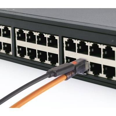 A black network switch with an orange Ethernet cable plugged into one of its ports.