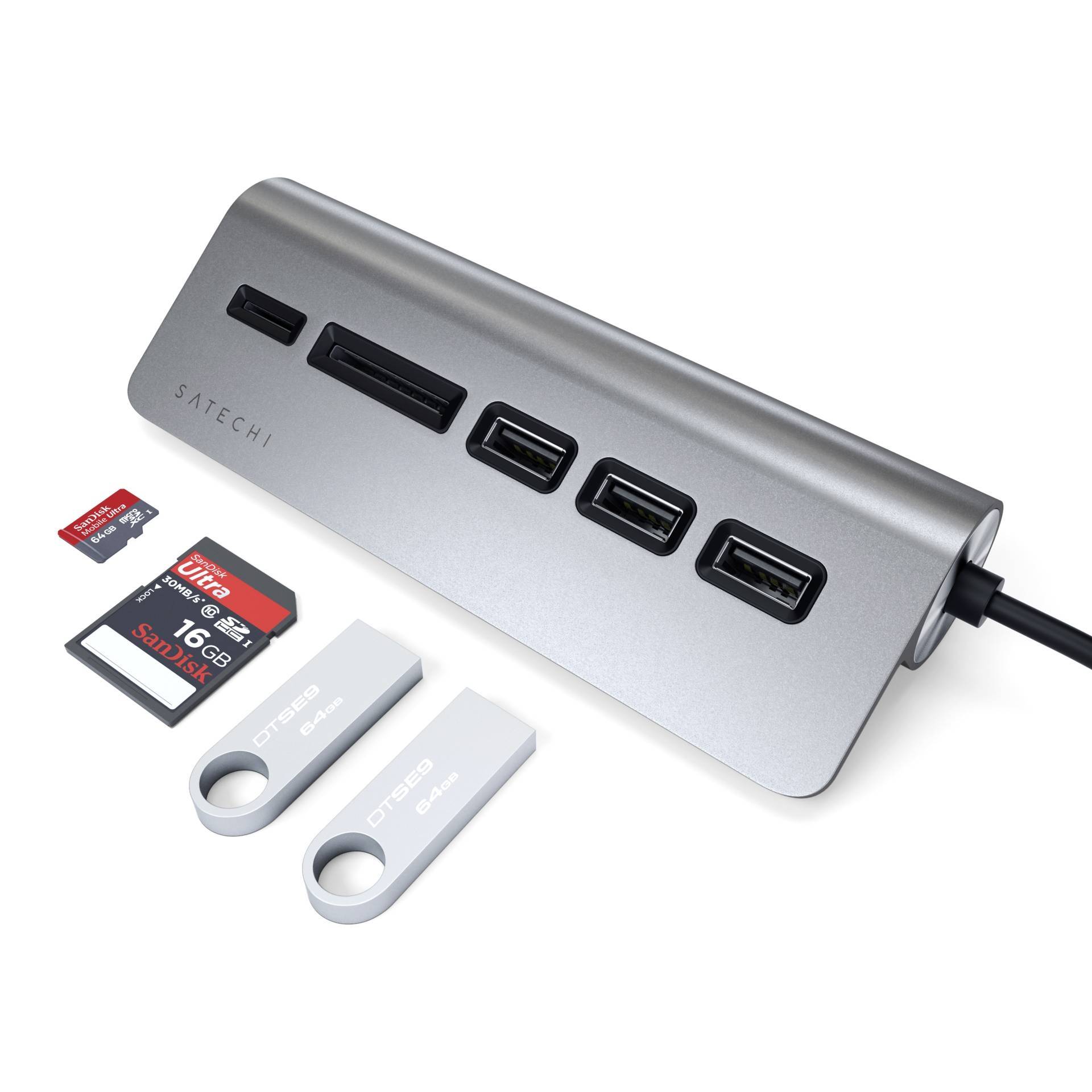 A USB hub with three USB ports, two SD card slots, and one microSD and one CF card slot. Next to it are memory cards and USB drives.