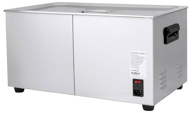 A silver ultrasonic cleaner with a black handle, switch and power connection. The device has a rectangular design.