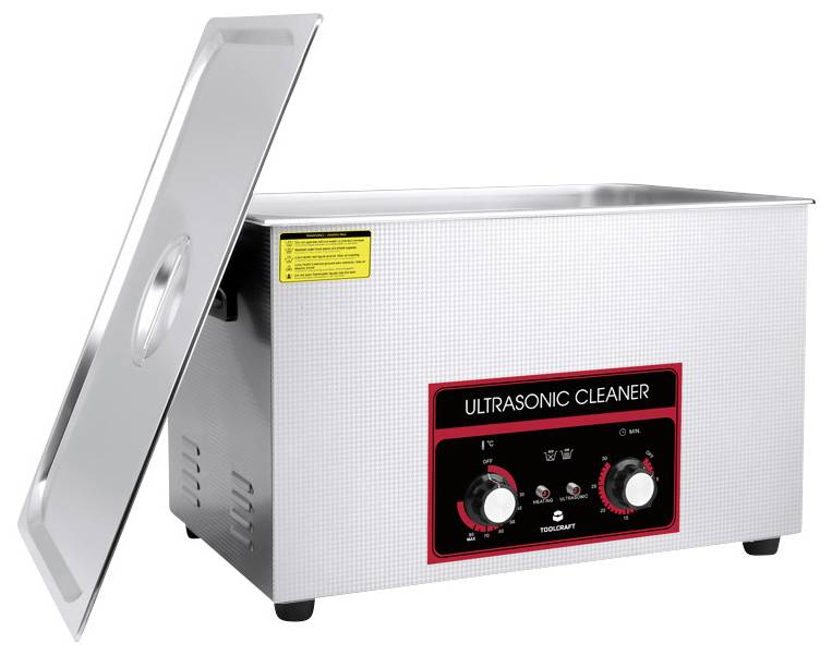 An ultrasonic cleaning device with a stainless steel casing, open lid, and control panel featuring rotary knobs for time and temperature settings.