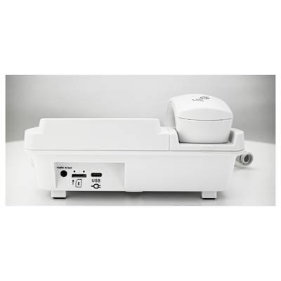 A white, modern device with a headphone on the top surface. On the front, there are sockets for audio and USB.