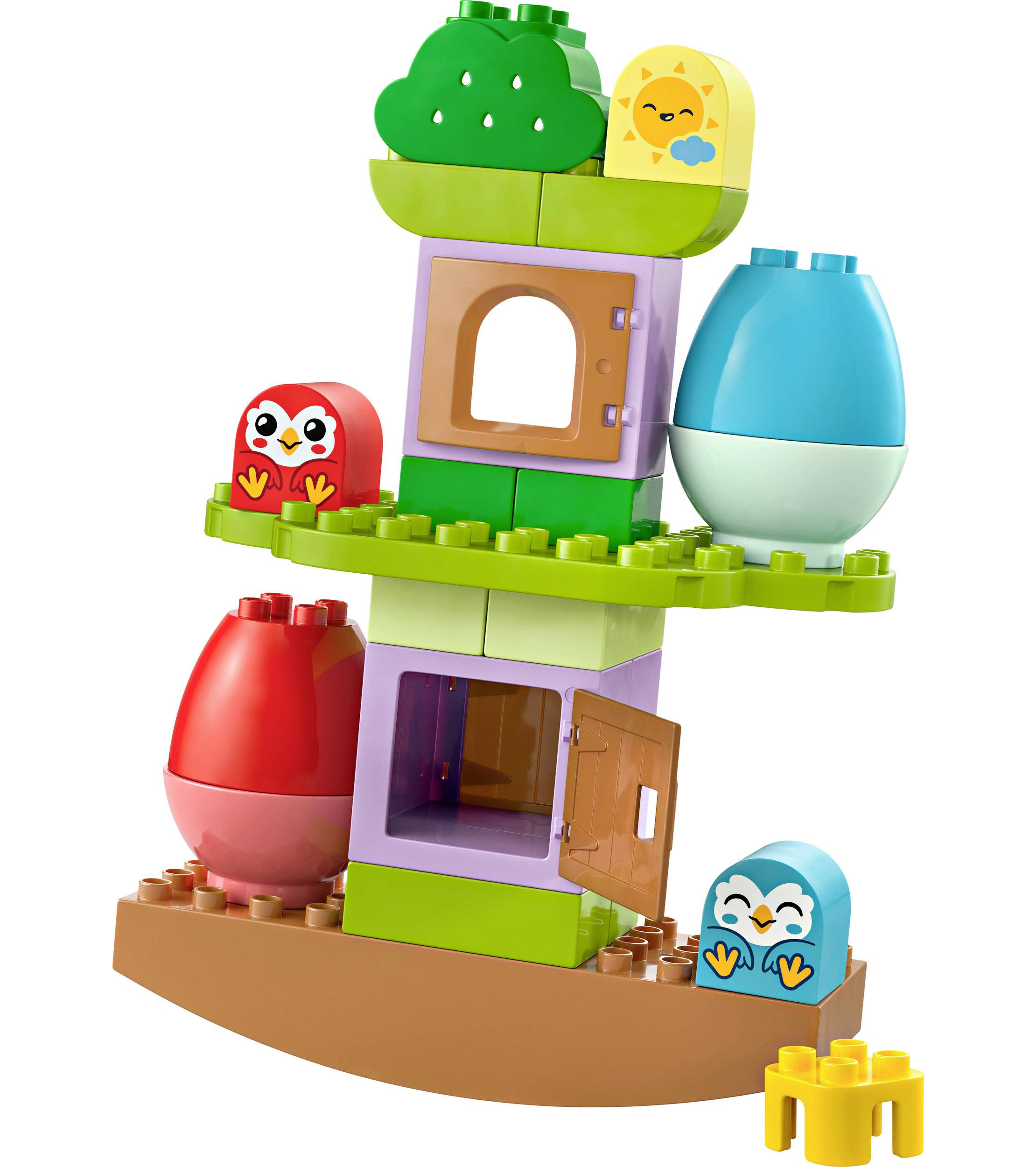 Colourful LEGO Duplo stacking blocks in the shape of eggs, birds, and trees, assembled into a balancing and play tower for young children.