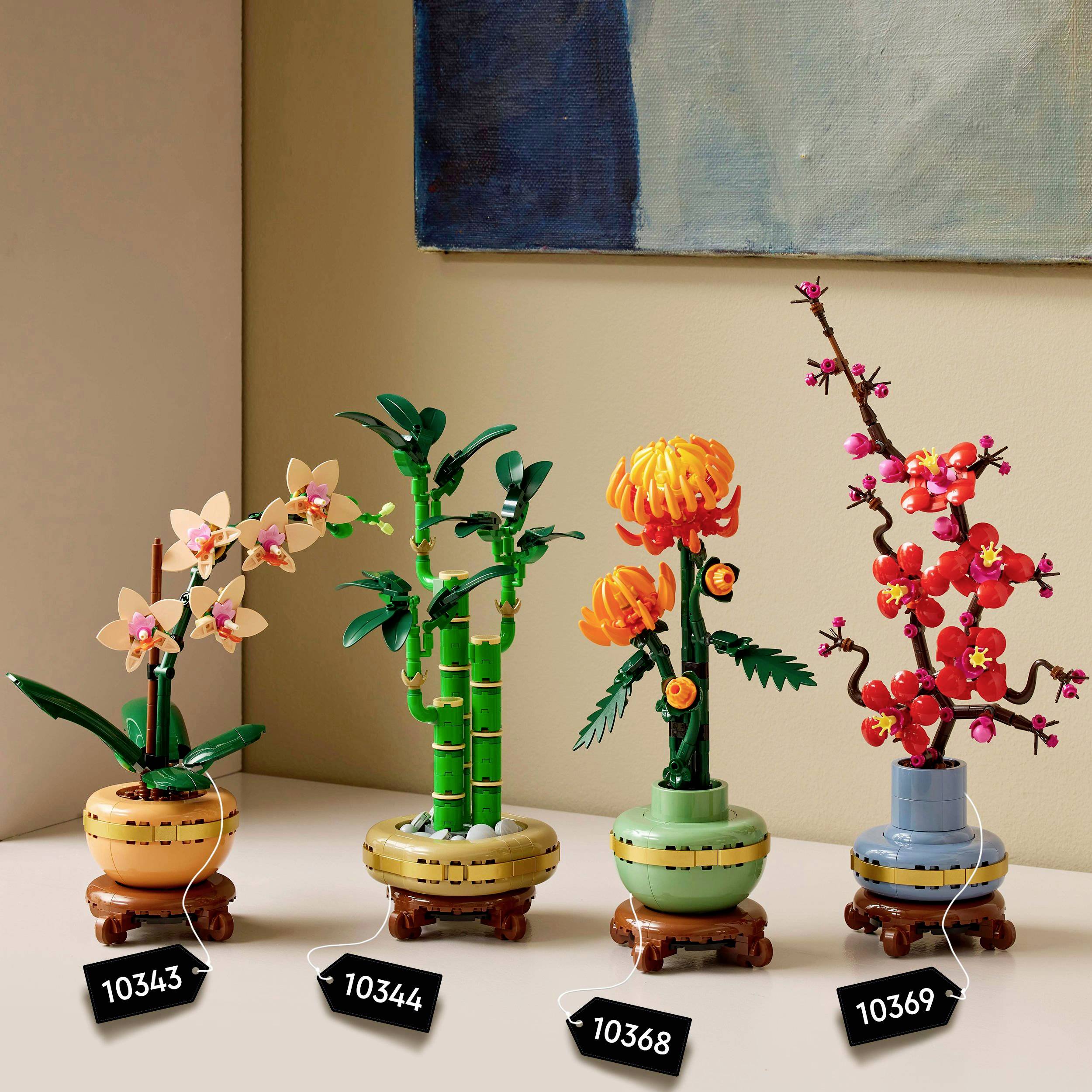 Four decorative models showcase plants and flowers made from building blocks, including orchids, bamboo, bonsai, and floral arrangements.