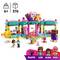 Construction kit for children aged 6 and over with 376 pieces: Figures in front of a colourful sweet shop with animals and accessories; Figures: Pluto, Leo, Alba, Gigi.