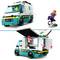 LEGO rescue vehicle set with skater. The ambulance has an opening rear section. Woman on skateboard beside it.