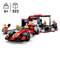 A red LEGO racing car model in a pit lane scene with three minifigures changing tyres. From 6 years, 322 pieces.