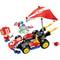 A construction kit with a racing car and accessory elements such as a parachute and a helmeted figure. Contains colourful building blocks and decorations.