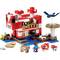 LEGO Minecraft Set with a red building, minifigures and animals such as a dog and a sheep. Includes a blue river, green tree and accessories.