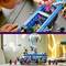 Child playing with Lego set: Blue bus with figures, including a pink teddy bear. Balloon is attached to the bus. Creative play in the children's bedroom.