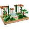 A LEGO set depicts a Mediterranean garden with a fountain in the centre, surrounded by trees and flowers on a terracotta-coloured base.