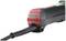 Electric power tool in close-up with red and black casing, cable connected, likely a hand tool for construction work.