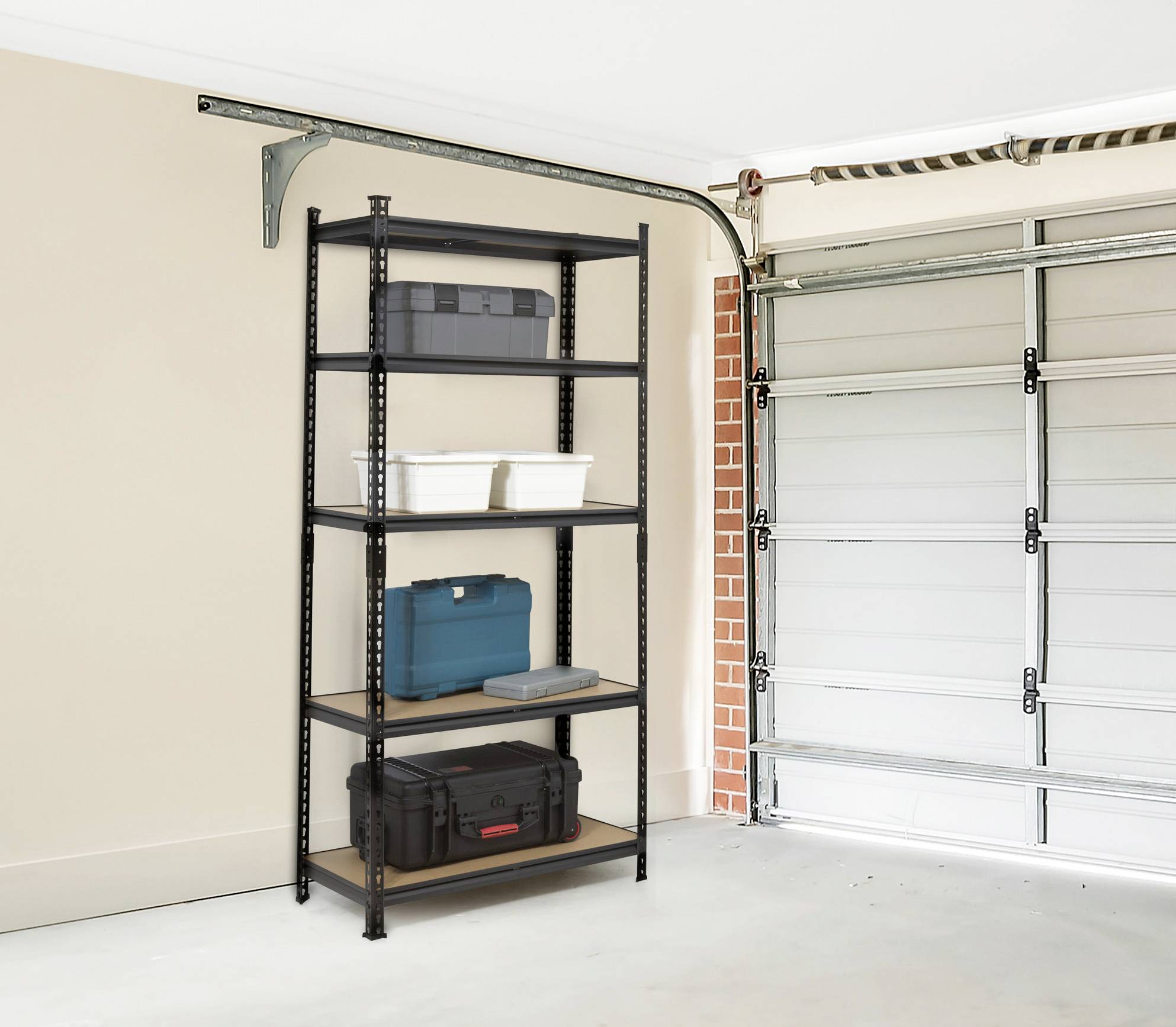 A metal shelving unit with multiple levels stands in a garage. Boxes and storage containers are placed on it. A garage door is on the right.