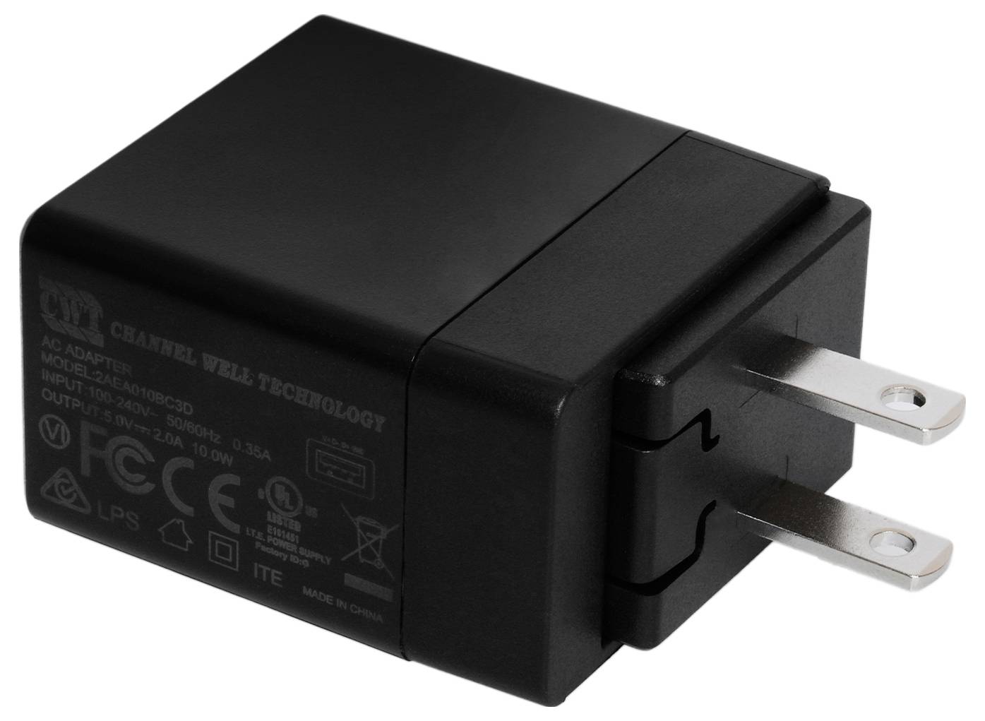 A black power adapter with two metal pins. Technical specifications and various certification logos are visible on the side.