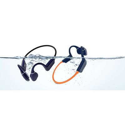 Two pairs of waterproof headphones, one with a black band and one with an orange band, float in clear water.