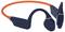 Dark blue bone conduction headphones with an orange neckband, marked with 'Creative'.