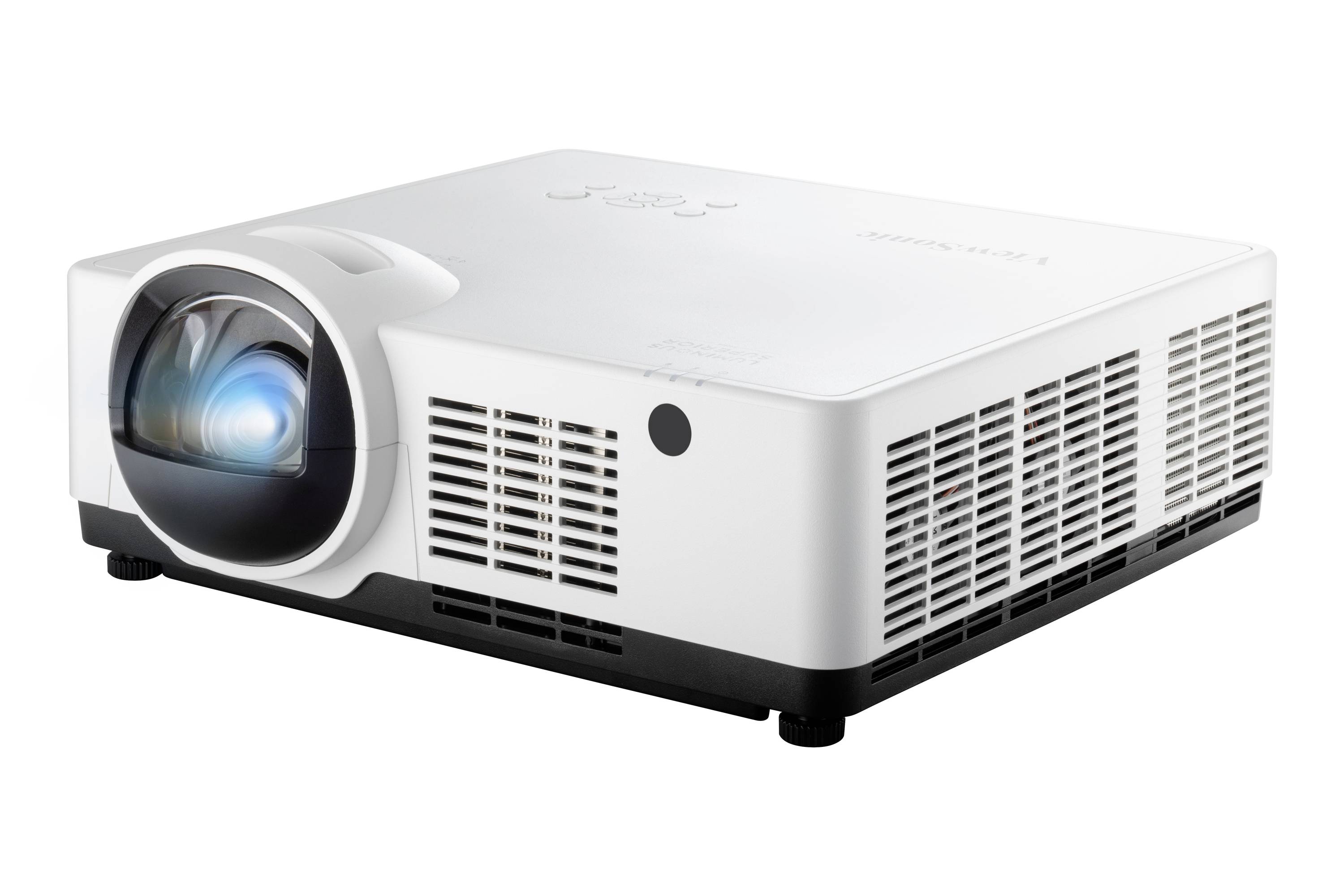 A white projector with ventilation slots on the side and a visible lens. It sits on small feet on a surface.