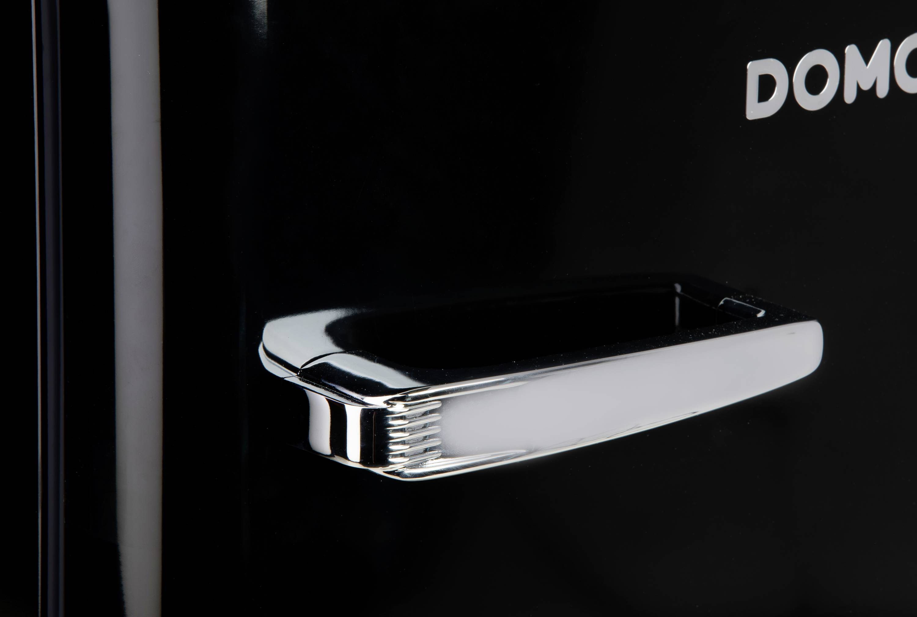 Close-up of a shiny metal handle on a black refrigerator door.