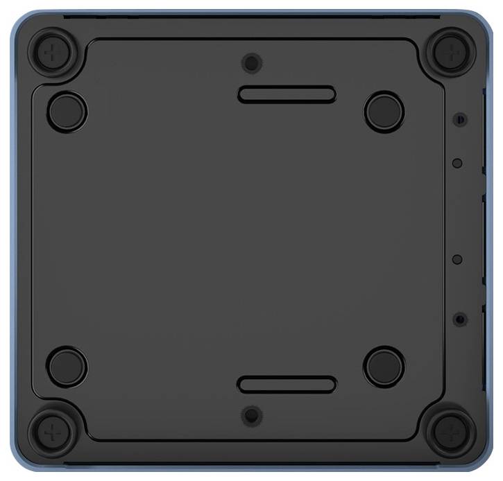 The underside of a rectangular black device with round rubber feet in the corners and several screw holes in the centre.