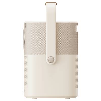 A portable, cream-coloured speaker with a carry handle, side view.