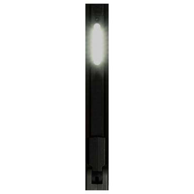 Close-up of a narrow black vertical object with a bright glowing white center, resembling a lit indicator or light fixture.
