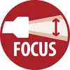 Red circular icon showing a camera lens with a spotlight beam and the word 'FOCUS' below.