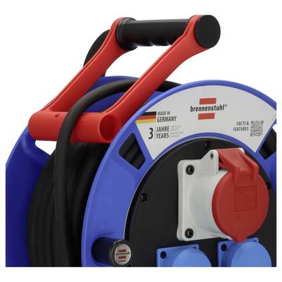 Close-up of a blue and red Brennenstuhl cable reel with a black handle and coiled black cord, labeled 'Made in Germany' and '3 years'<br>