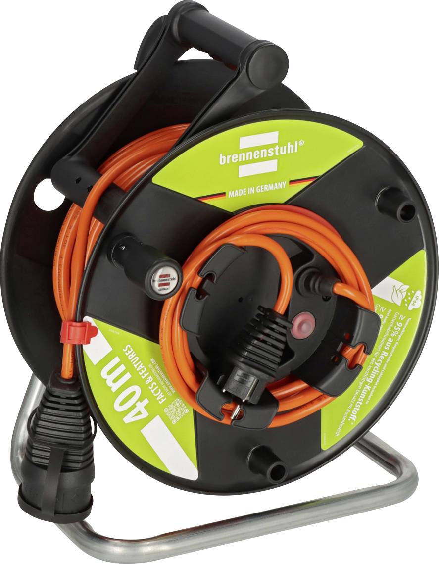 Orange extension cord wound on a black Brennenstuhl cable reel with handle, stand, and power plug, isolated on white background