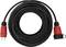 A black extension lead with red plugs at both ends, coiled in a circle. Suitable for outdoor use.