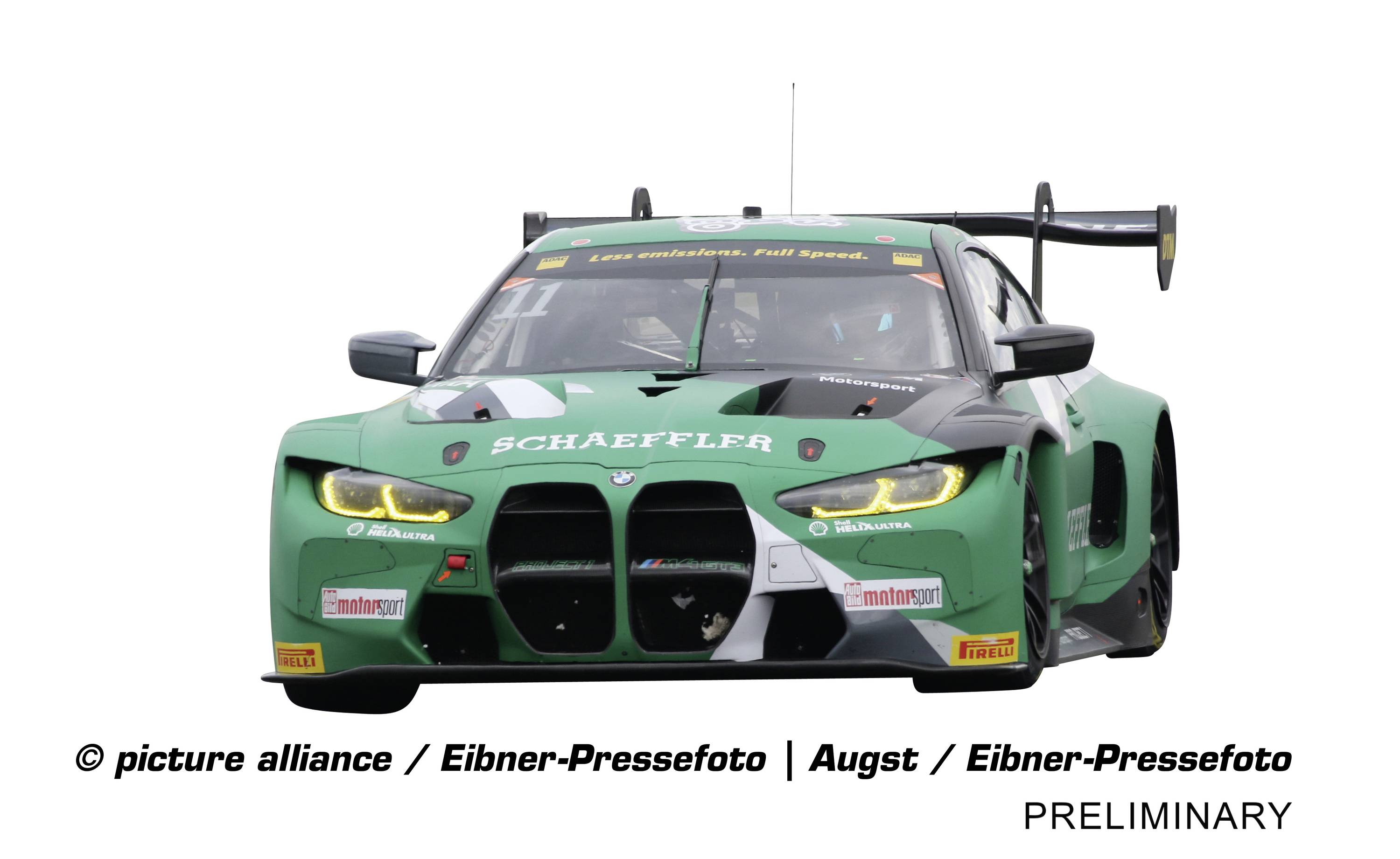 Green racing car with 'Schaeffler' inscription driving head-on towards the camera. Brand logos are visible.