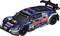 A model car in the design of a racing car with Red Bull advertising and various sponsor logos. It has a blue and red paint finish.