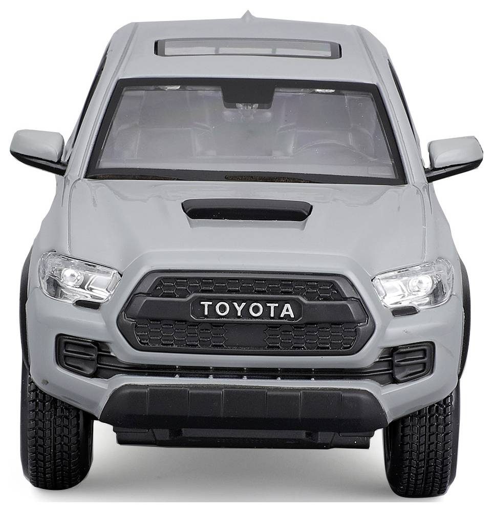 Grey model car of a pickup truck from the front, view of the front perspective with recognisable details such as the radiator grille and headlights.