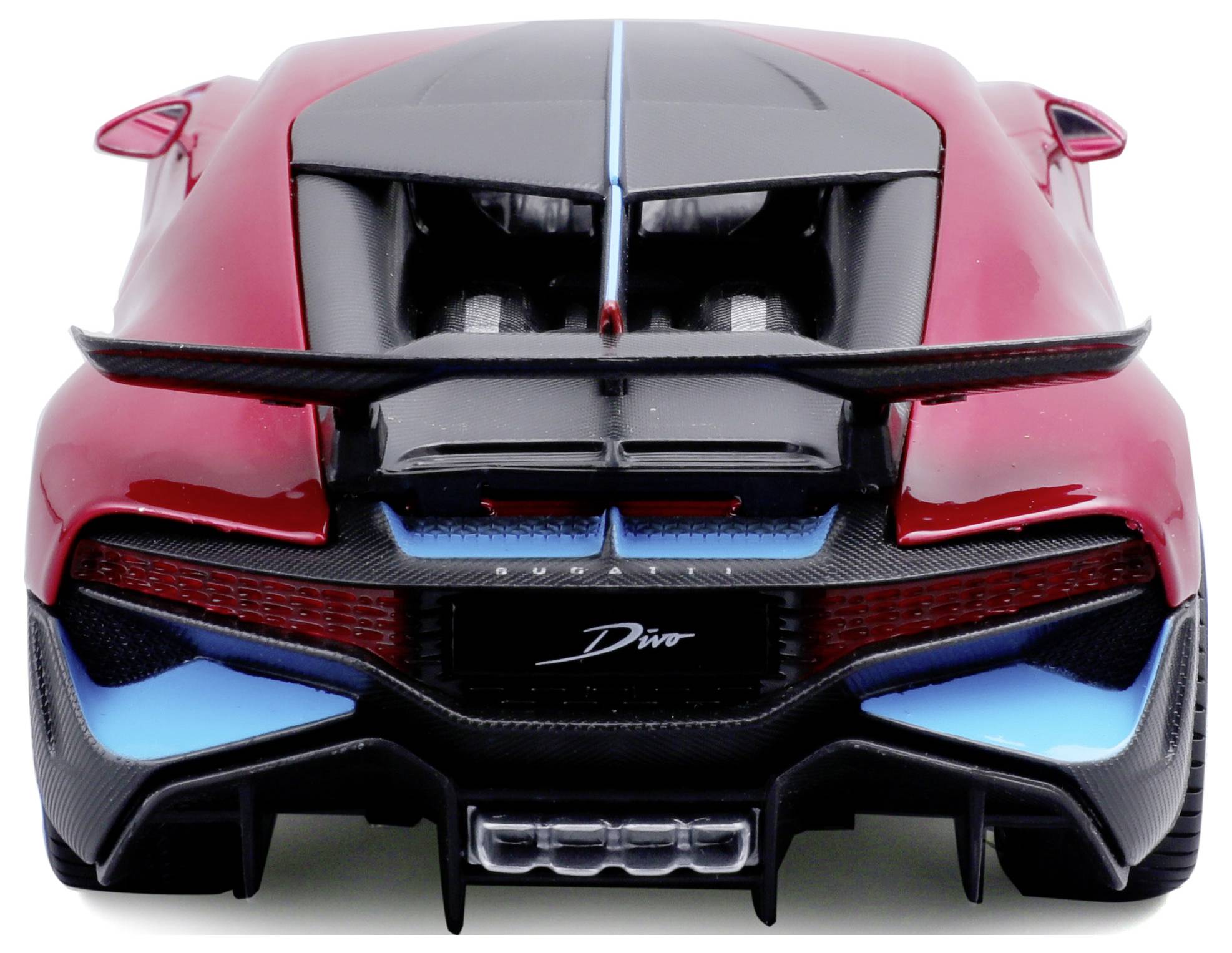 Red sports car from behind, with black and blue accents, prominent rear spoiler, and large exhaust.